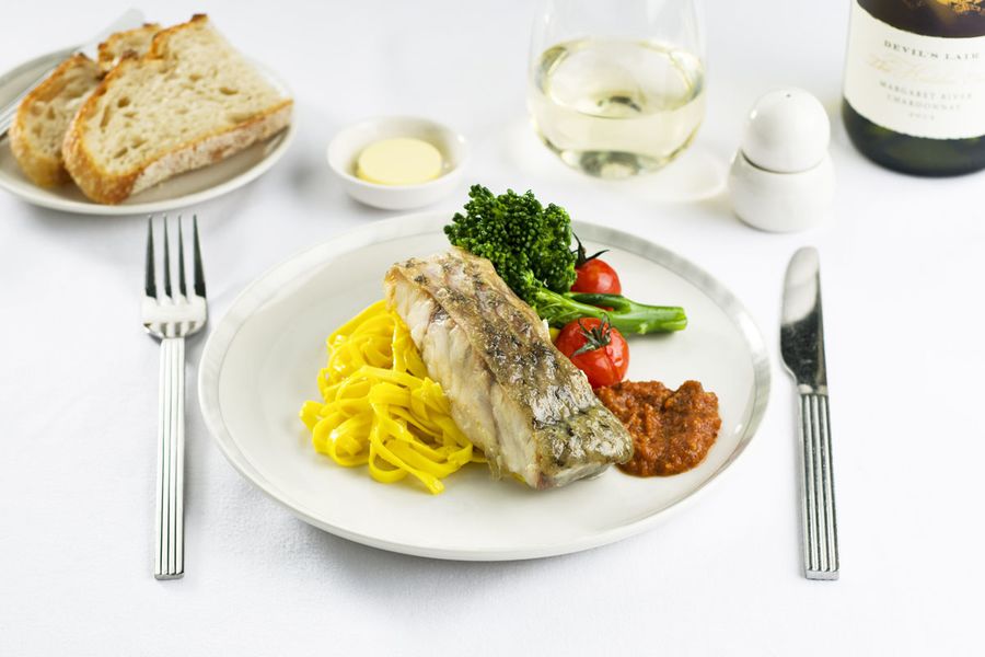 Pan-fried barramundi in native pepper berry sauce, with sauteed vegetables and saffron
